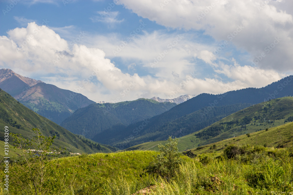 Mountains landscape of the Kaskelen gorge in the Tien-Shan Mountains, Almaty, Kazakhstan Mountains landscape of the Kaskelen gorge in the Tien-Shan Mountains, Almaty, Kazakhstan