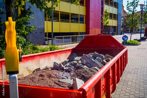 container in the city with construction debris