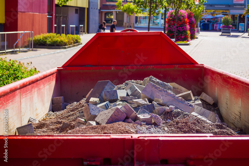 container in the city with construction debris