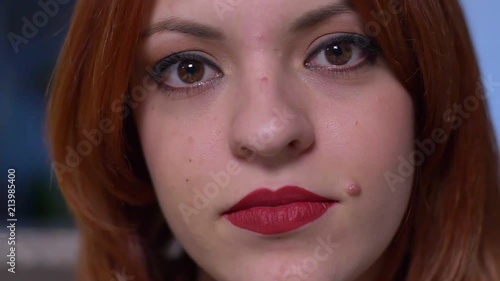 Wallpaper Mural Attractive sensual red hair young woman smiling at camera- slow motion Torontodigital.ca