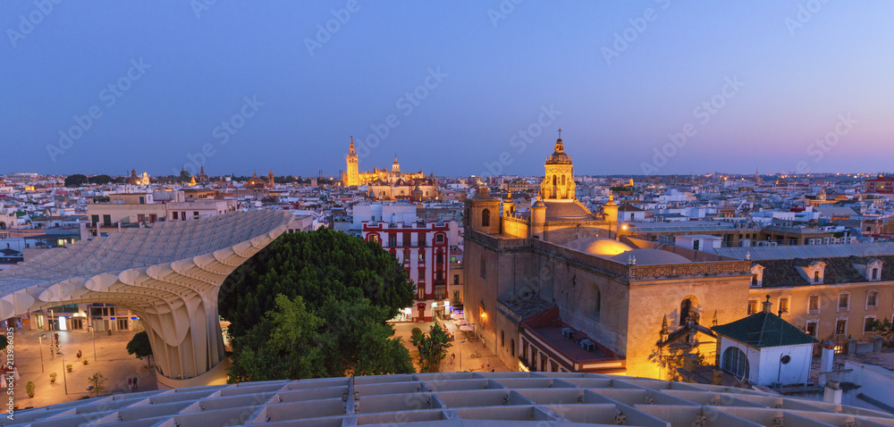 Naklejka premium Seville, Spain. Panorama of the illuminated city after sunset, view from above