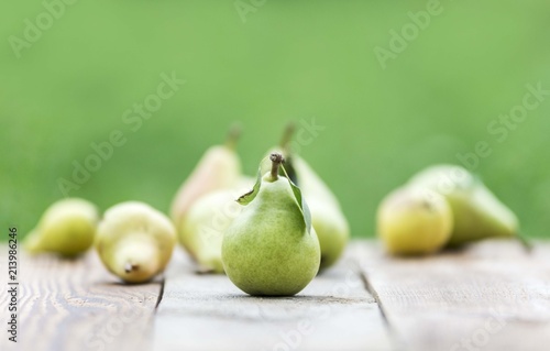 Pear fruit isolated on wooden table. Pears background