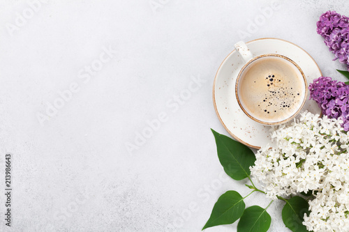 Colorful lilac flowers and coffee cup