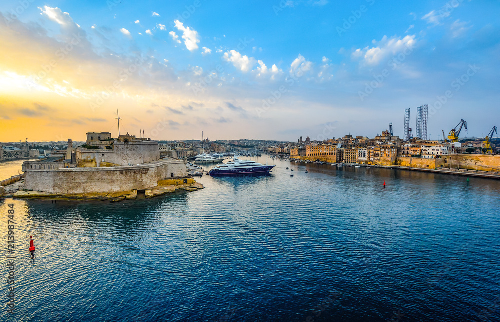 Sunrise at the grand harbor on the Mediterranean island of Malta as the cruise ships arrive in the summer