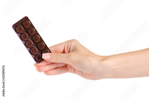 Medicine pills in blister, drug tablets in hand isolated on white background. Pharmacy and medication.