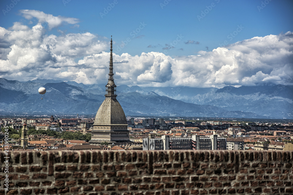 Panoramic view of Turin city center, in Italy, in a sunny day, with Mole Antonelliana and Alps in the background