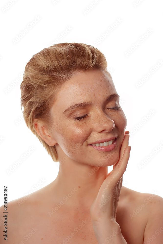 Young beautiful freckles woman face portrait with healthy skin Young beautiful freckles woman face portrait with healthy skin