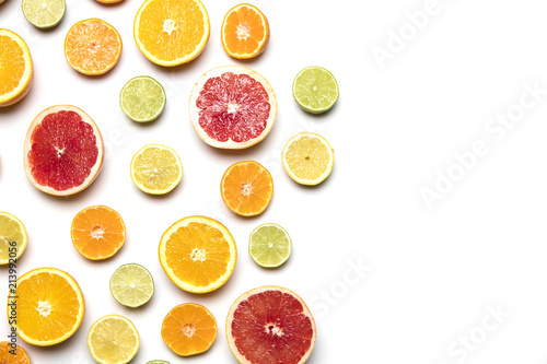 Citrus fruit background. Slices of grapefruit  orange  lemon and lime