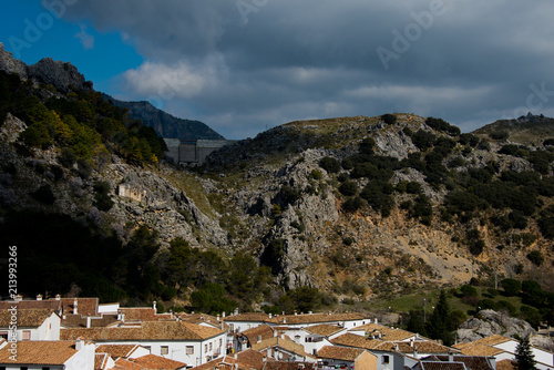 roof patterns and reservoir dam of andalusian white village grazalema, spain