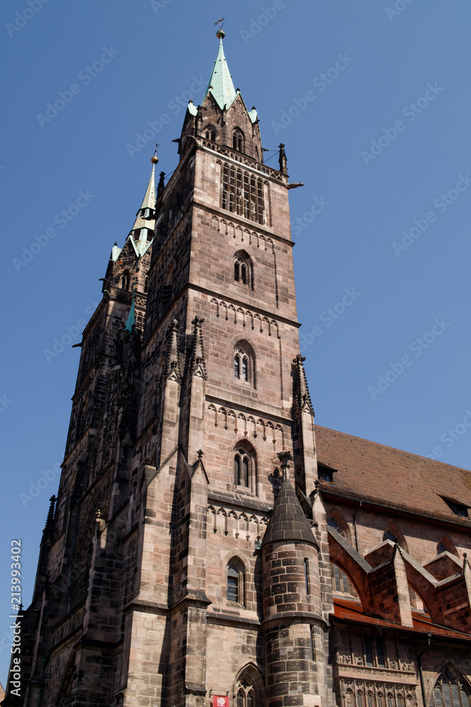 Saint Lawrence cathedral on the blue sky background. Medieval gothic church in Nuremberg, Bavaria, Germany