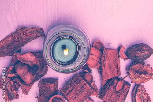 Beautiful burning candle on wooden background