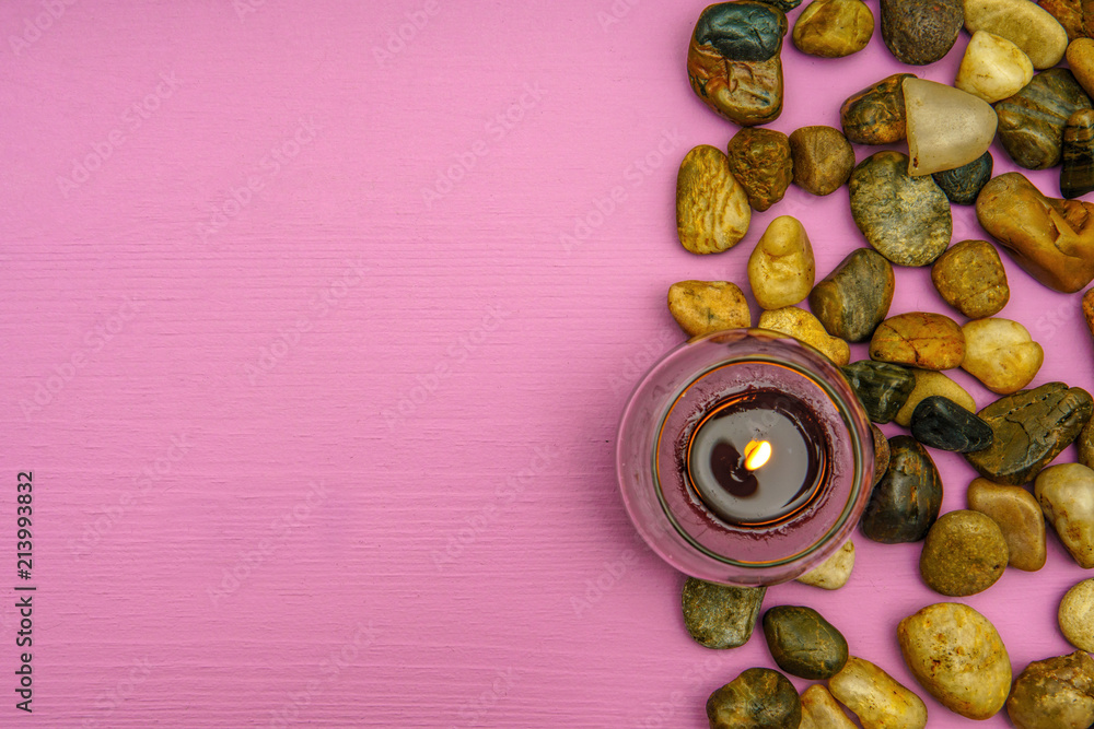 Fototapeta premium Beautiful burning candle on wooden background