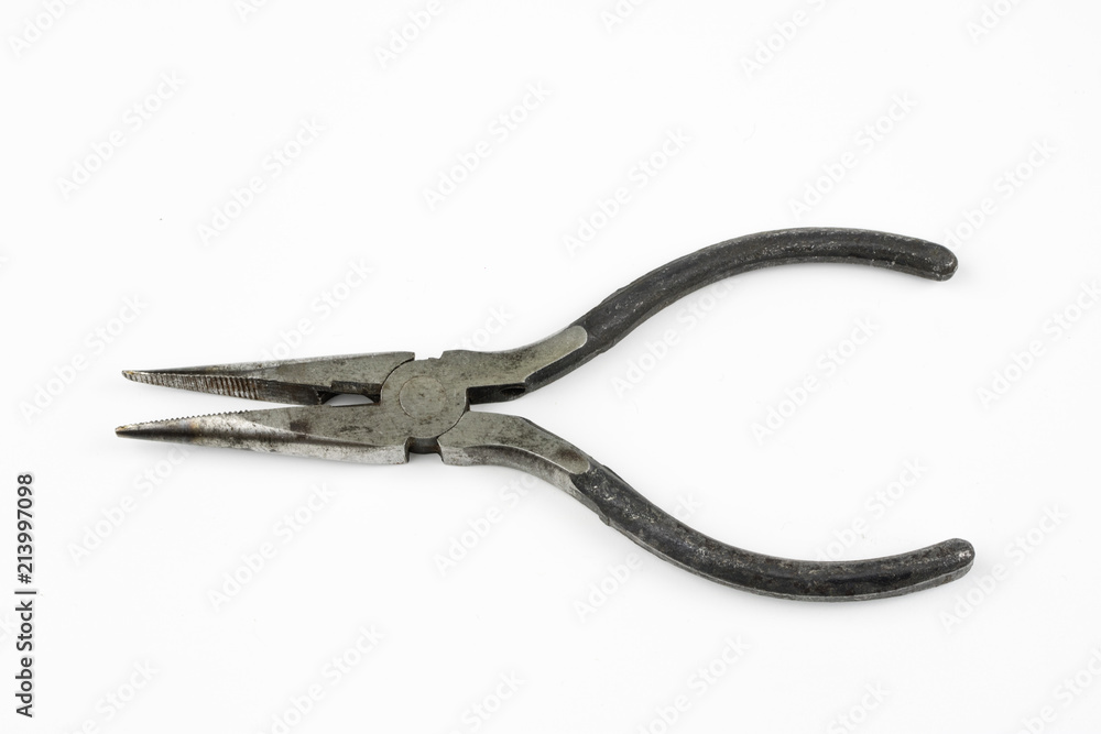 Pliers and cable cutters on a white table. Accessories for DIY enthusiasts and electricians. Pliers and cable cutters on a white table. Accessories for DIY enthusiasts and electricians.