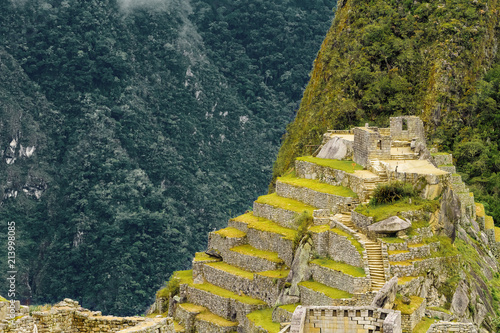 Intihuatana building (sacred place) of Machu Picchu with Uña Picchu mountain in the background photo