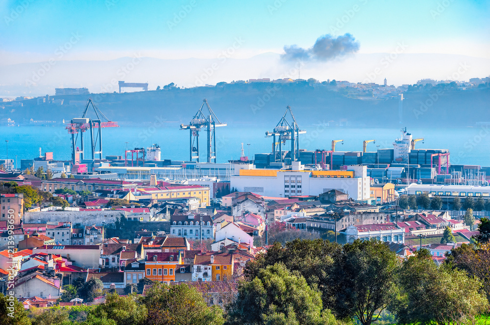 Lisbon skyline, cranes and cargo containers