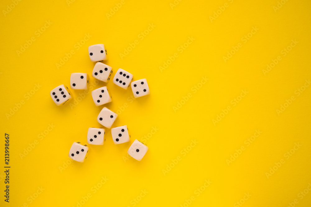 dice on a yellow background in the form of a man dice on a yellow background in the form of a man