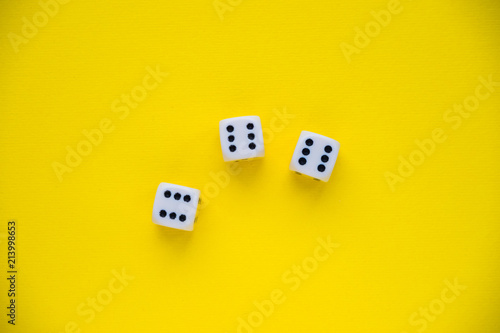dice on a yellow background