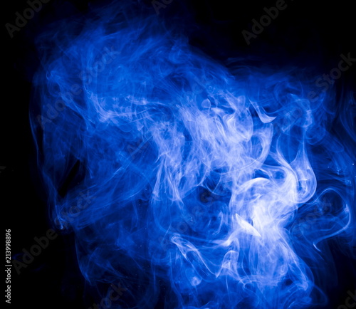 Blue smoke on black background