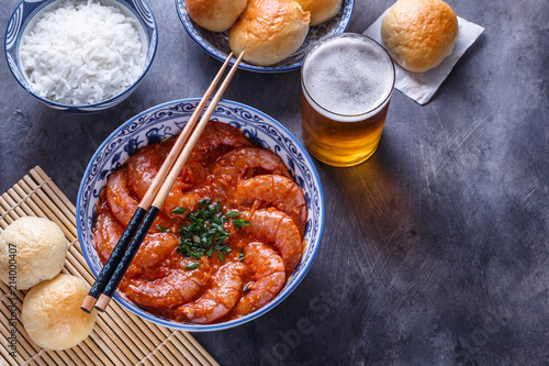 Bowl of shrimps with chopsticks, rice and beer, copyspace