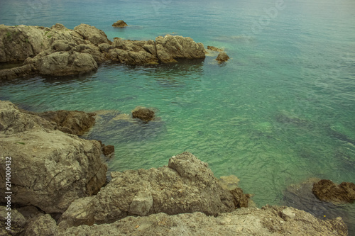 rest concept of empty blue sea resort waterfront coast district with stones in colorful summer bright day time and nobody else 