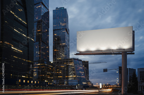 Blank billboard at twilight next to skyscrapers. 3d rendering photo