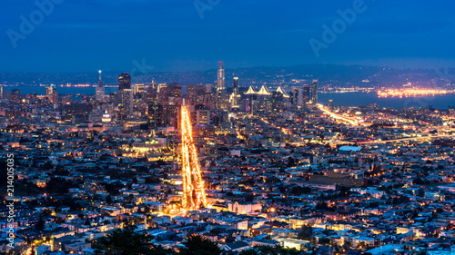 View of San Francisco from above. Long exposure at night. dramatic sky, lights and glitters.