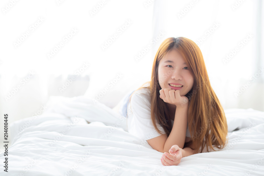 Beautiful portrait young asian woman lying and smile while wake up with sunrise at morning, lifestyle and relax concept. Beautiful portrait young asian woman lying and smile while wake up with sunrise at morning, lifestyle and relax concept.