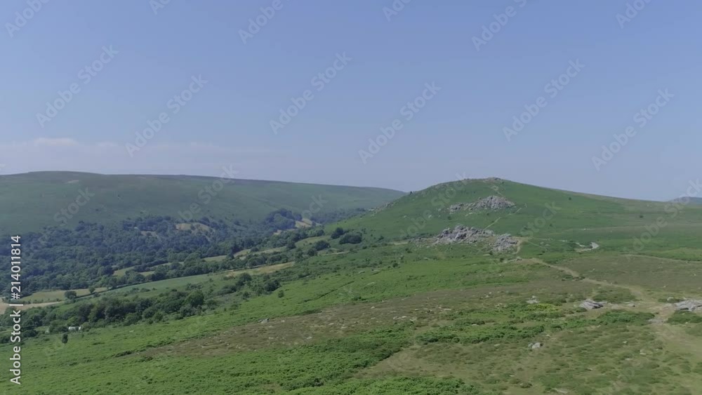 Wide aerial shot tracking forward slowly towards bonehill rocks. Dartmoor, England. Wide aerial shot tracking forward slowly towards bonehill rocks. Dartmoor, England.