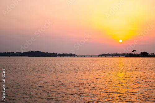 JEDDAH, SAUDI ARABIA - MAY 20, 2017. Romantic golden, red and orange sky light at Jeddah Corniche, famous local place and beach. King Fahd Fountain is the biggest fountain in the world, near