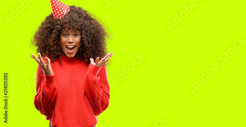 Photography African american woman celebrates birthday very happy and excited, winner expres