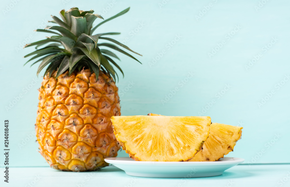Ripe pineapple on green background, tropical fruit Ripe pineapple on green background, tropical fruit