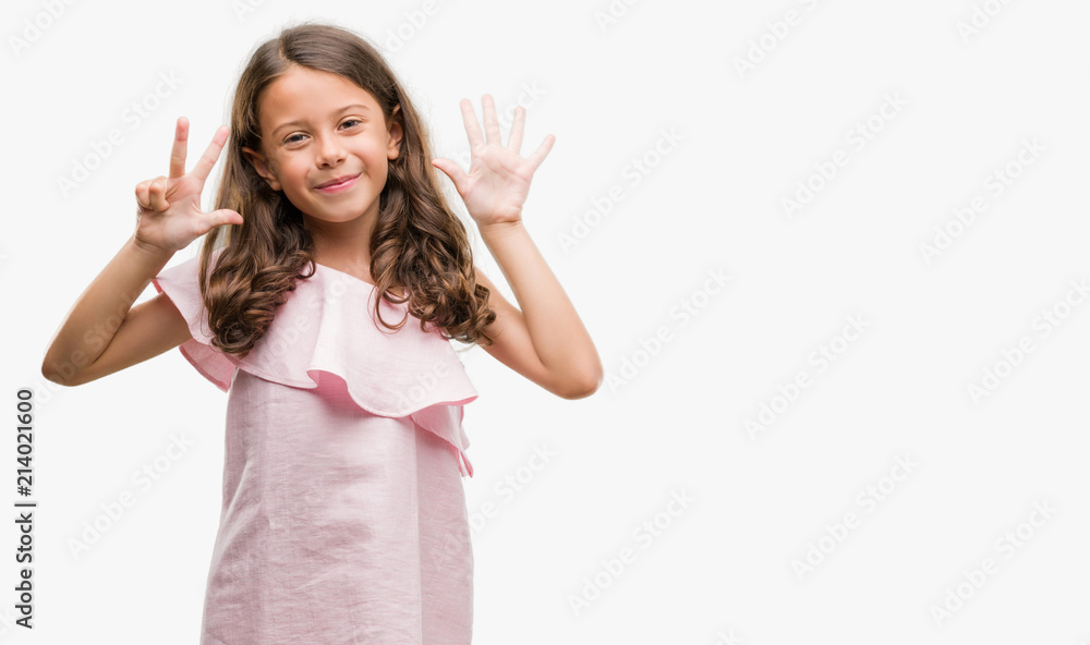 Brunette hispanic girl wearing pink dress showing and pointing up with fingers number eight while smiling confident and happy. Brunette hispanic girl wearing pink dress showing and pointing up with fingers number eight while smiling confident and happy.