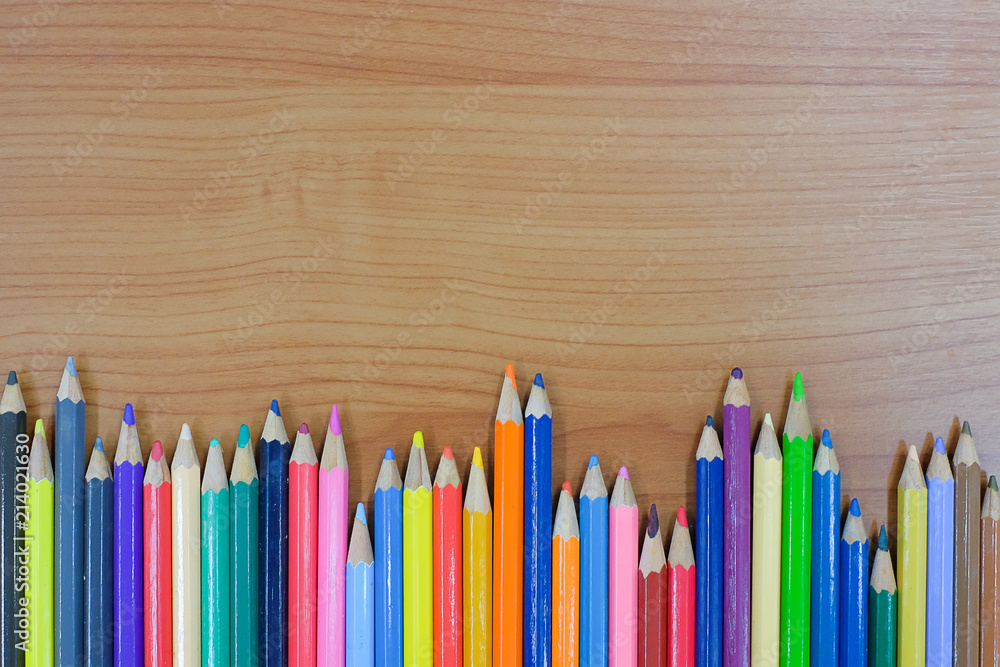 Color pencils on wooden background with copy space for your text. Back to school and Education concepts Color pencils on wooden background with copy space for your text. Back to school and Education concepts