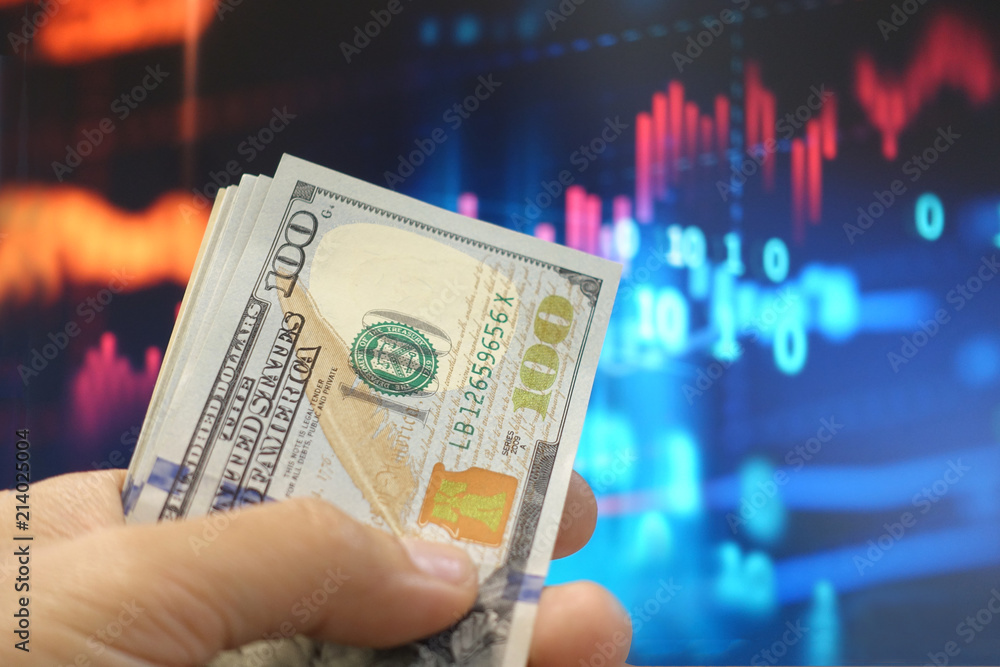 Φωτογραφία Investment business stock concept by people is handling big amount of money and stock graphic at background