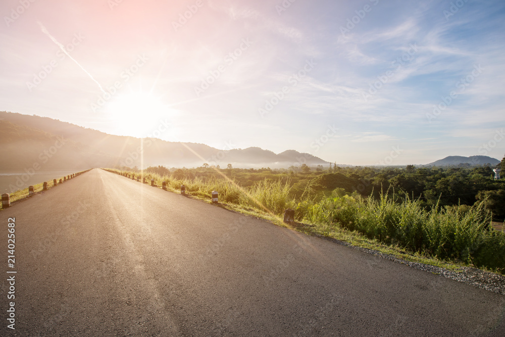 Asphalt road with reservoir on clearly blue sky and mountains. Asphalt road with reservoir on clearly blue sky and mountains.