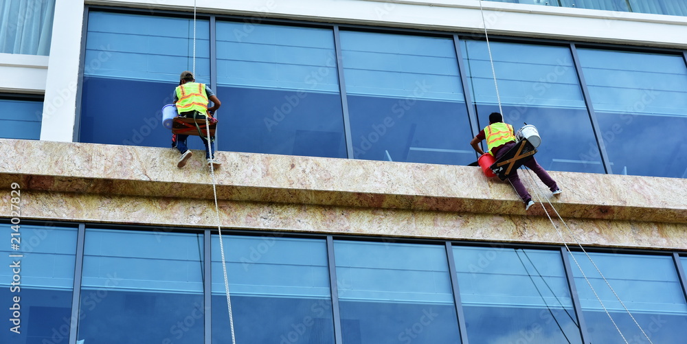 Window washers on the facade of the building. Vietnam. Nha Trang