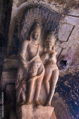 Cave 3 : Brackets of the pillars, shows a Kama scene on one pillar, where a woman and a man are in maithuna, erotic, embrace beneath a tree. Badami Caves, Karnataka, India. photo