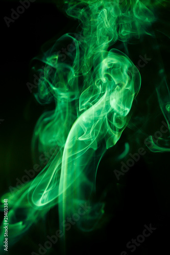 Green smoke movement on black background.