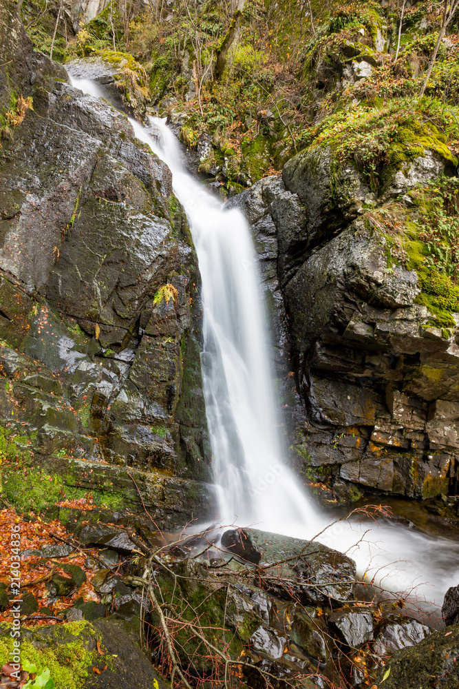 Blurred long exposure photograph at the river below the Boyanski waterfall, the Boyana river near Sofia, Bulgaria in fall, cold autumn day
