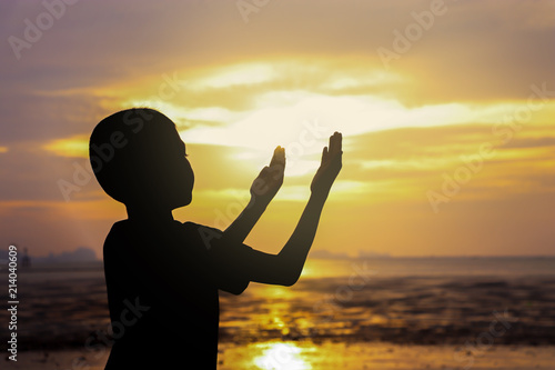 silhouette boy praying