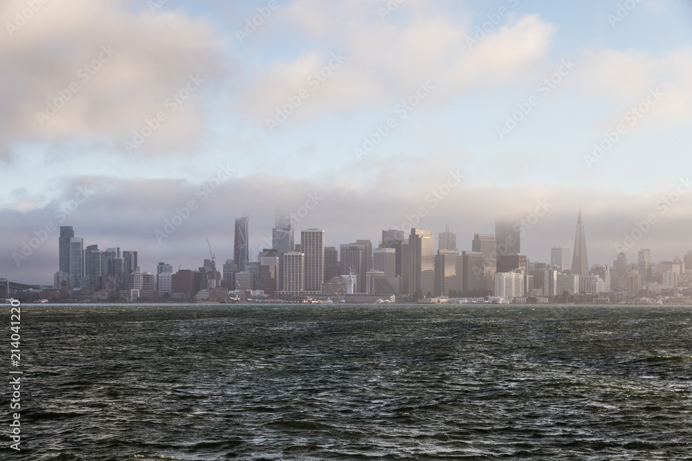 San Francisco downtown and financial district view from the Treasure island with late afternoon fog in California, USA