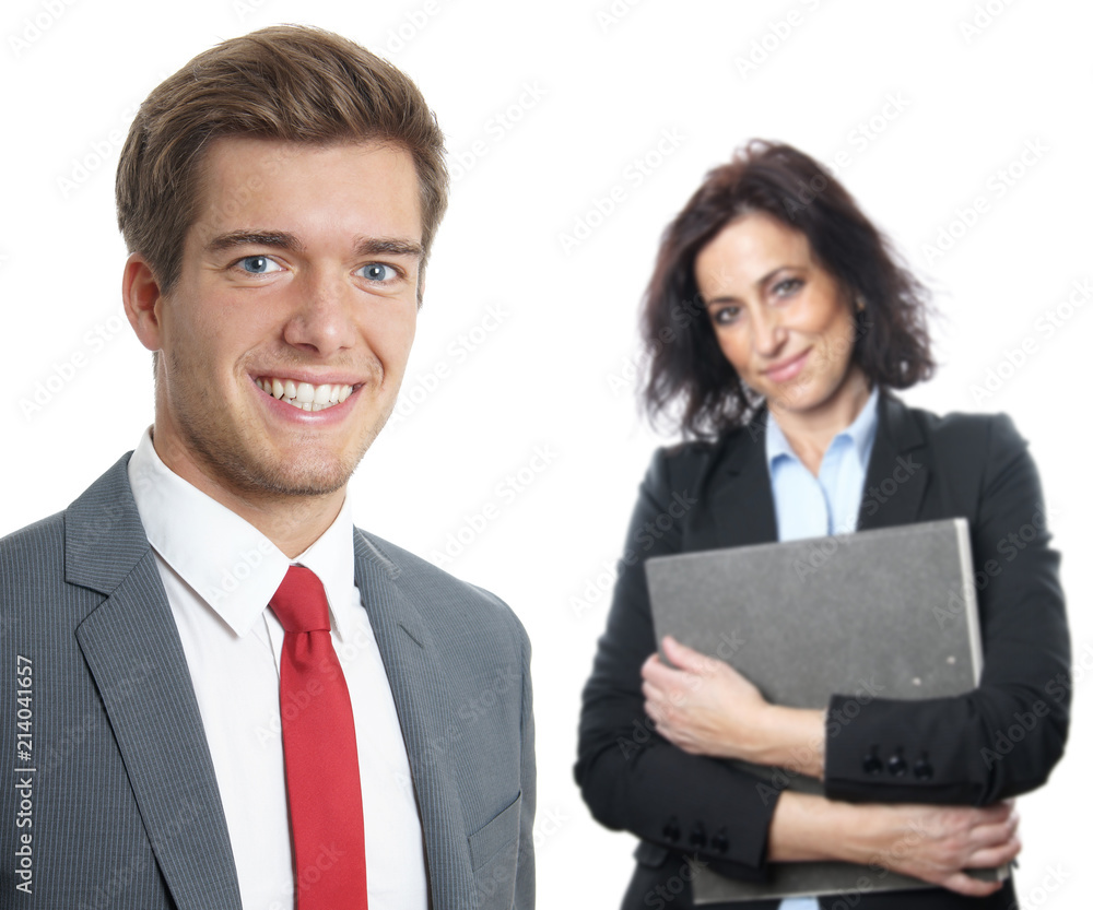 young business manager with secretary holding file folder in the background young business manager with secretary holding file folder in the background