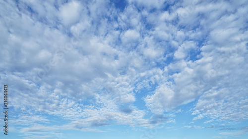 Fluffy clouds and blue sky photo