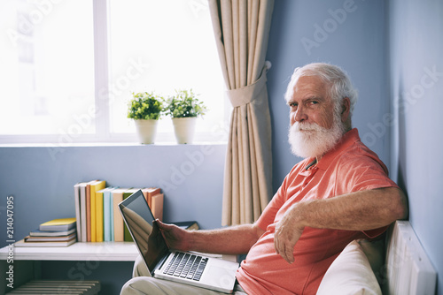 Aged man with laptop