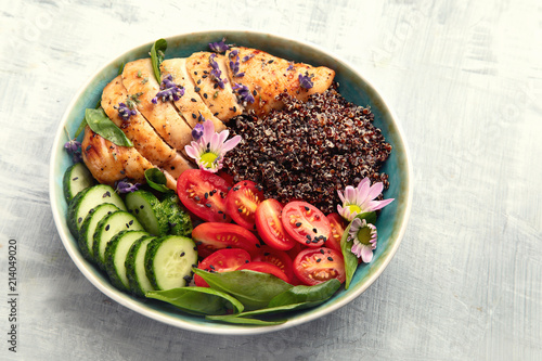 Healthy bowl with roasted chicken and quinoa.