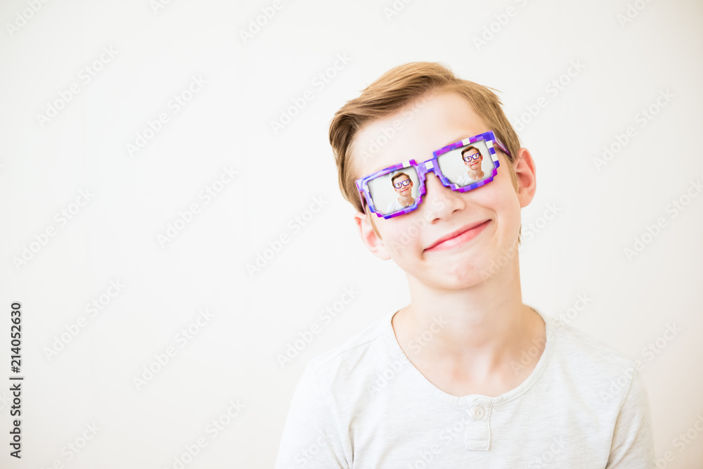 Young boy with glasses in minecraft style with multiple repetition