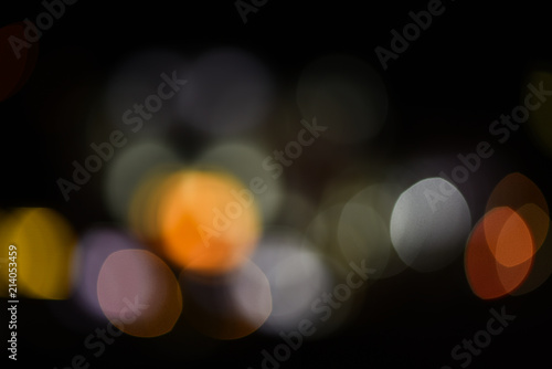 Lights of christmas garland blurred on black background. Lights of colorful garland defocused as beautiful background. Background concept. Christmas holiday decoration blurred © be free