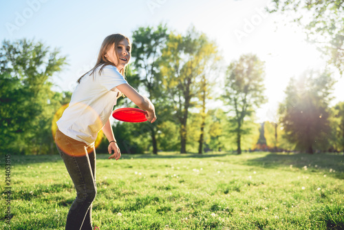 Girl throwing Frisbee photo