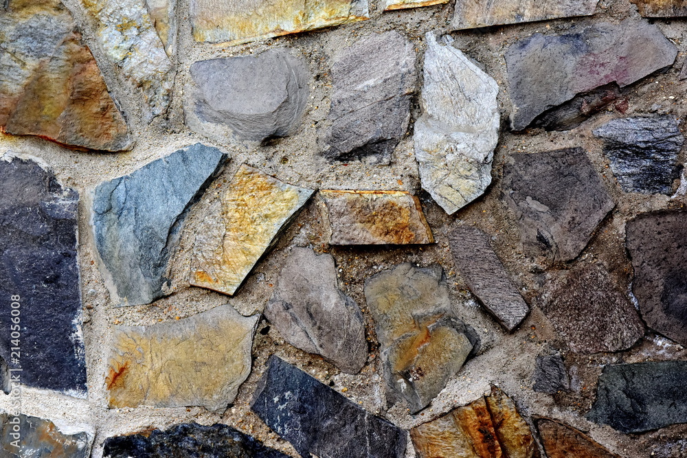 Pavement path for pedestrians from trolley plates of irregular shape made of natural layered stone Pavement path for pedestrians from trolley plates of irregular shape made of natural layered stone