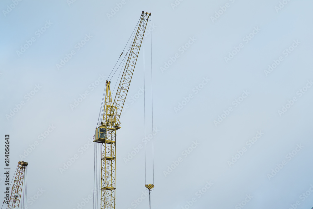 Crane on cloudy background. Building concept Crane on cloudy background. Building concept